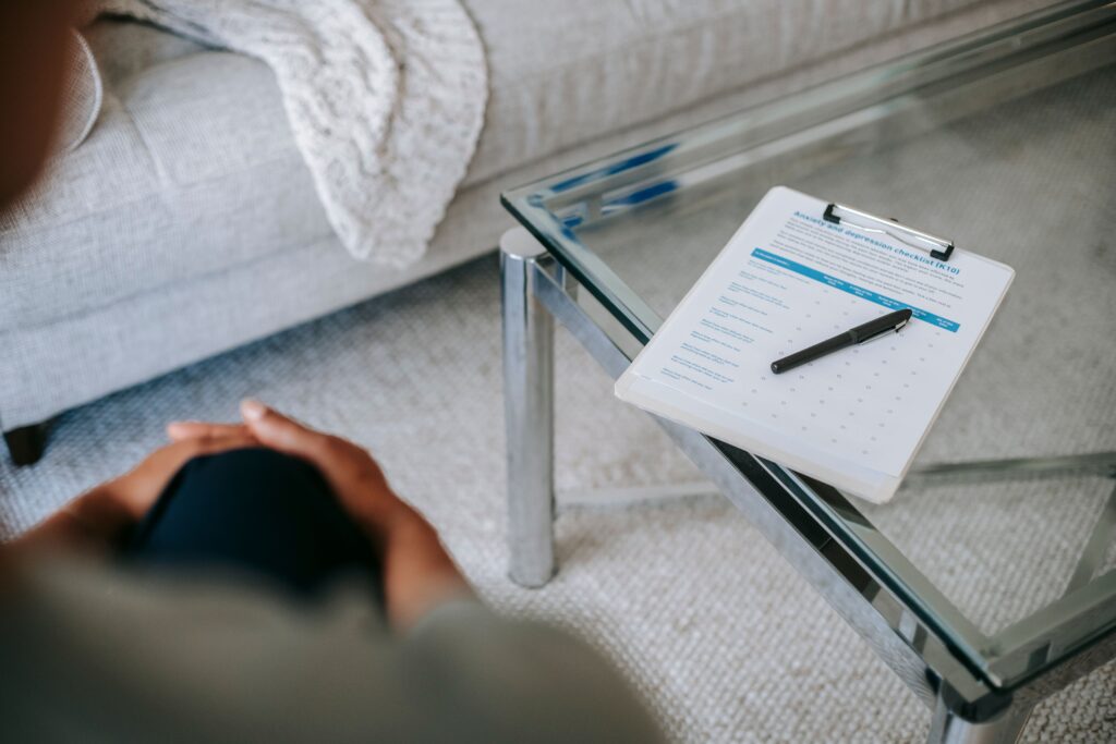 Healthcare evaluation checklist on a desk, representing a personalized health assessment and treatment plan.